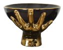 Black Bowl Held by Gold Hands